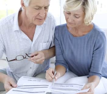 Senior couple dealing with bills.