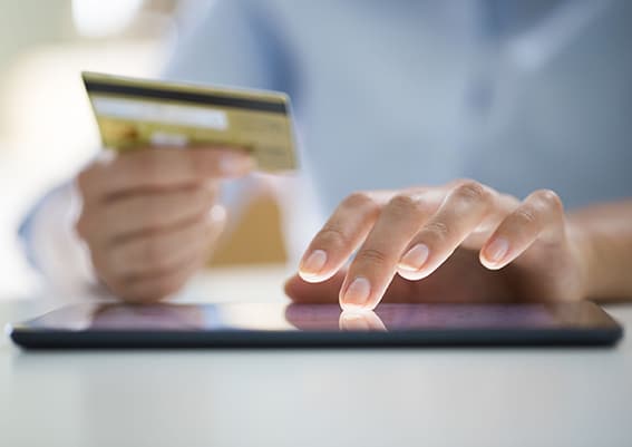 Woman is shopping online with digital tablet