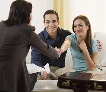 Happy Couple Meeting with Real Estate Agent