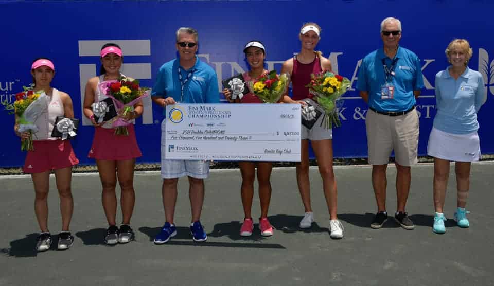 Harlan Parrish presenting check to double tennis winners
