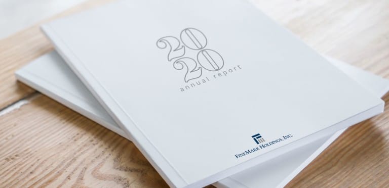 2020 annual report white books on wooden table