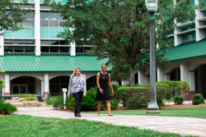 Jessica and Ashley walking at FGCU