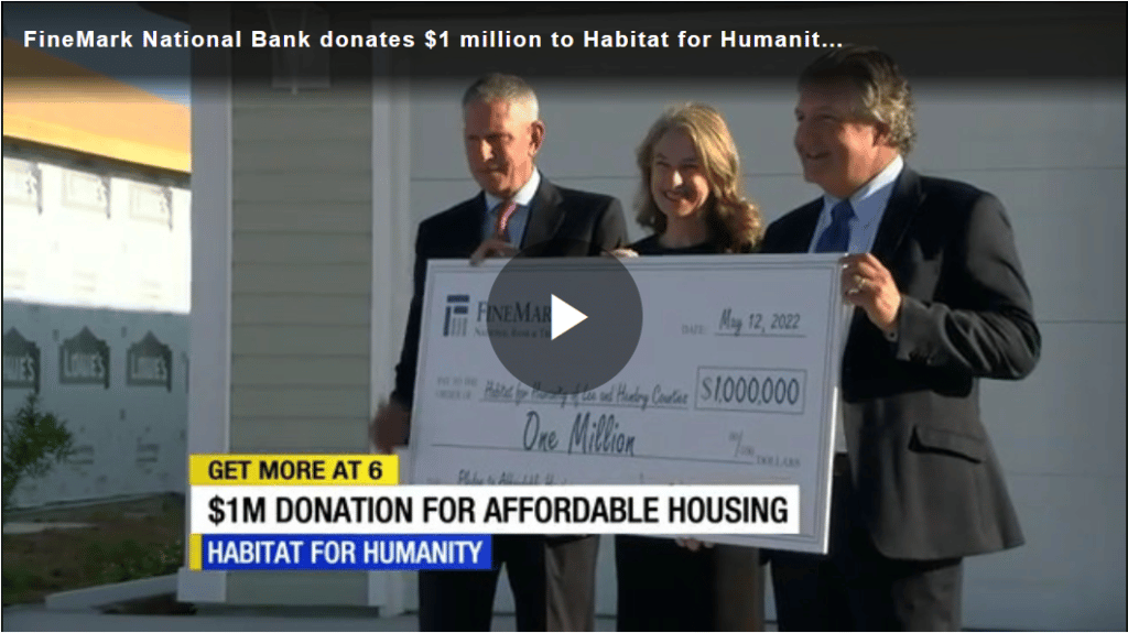 Joe, Becky, Robert holding $1M Check