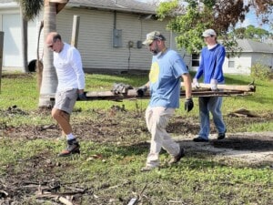 Read Sawczyn helping clean up debris