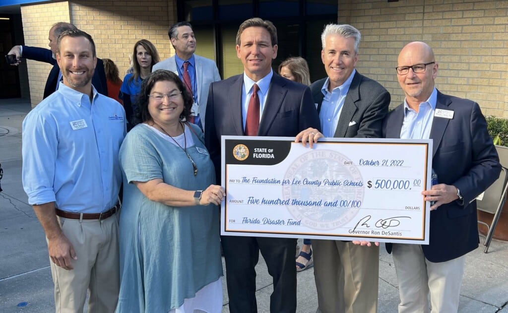 Harlan Parrish Gov DeSantis Check Presentation for Lee School Foundation