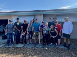 Group at home cleanup after Hurricane Ian