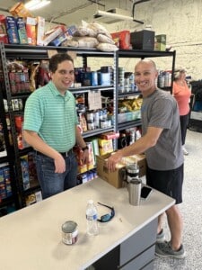 Jared and Bill packing boxes