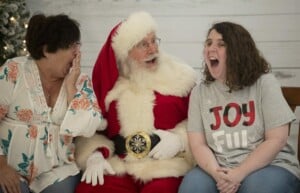 Santa with girl and mother