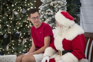 Santa talking to a teenage boy