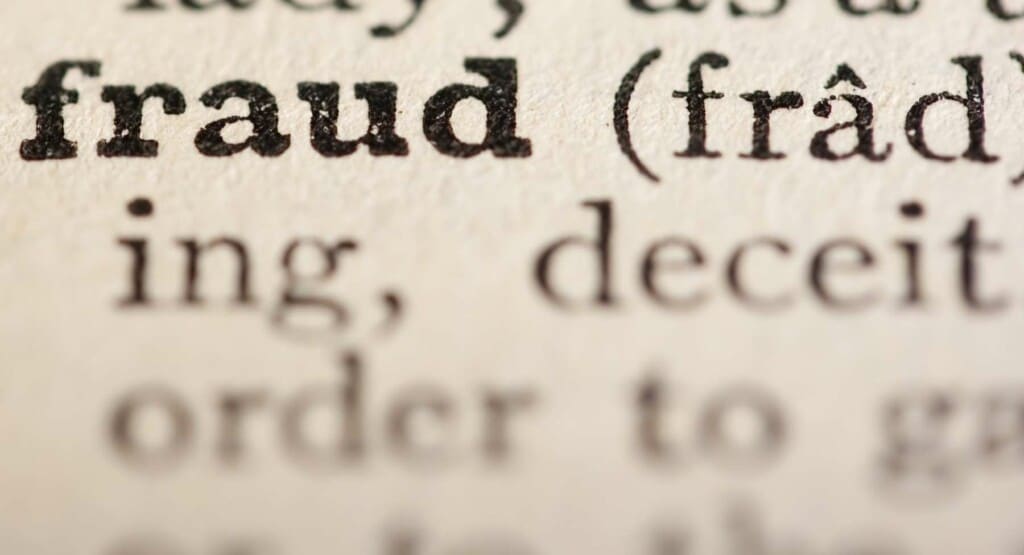 Word fraud from the old dictionary, a close up.