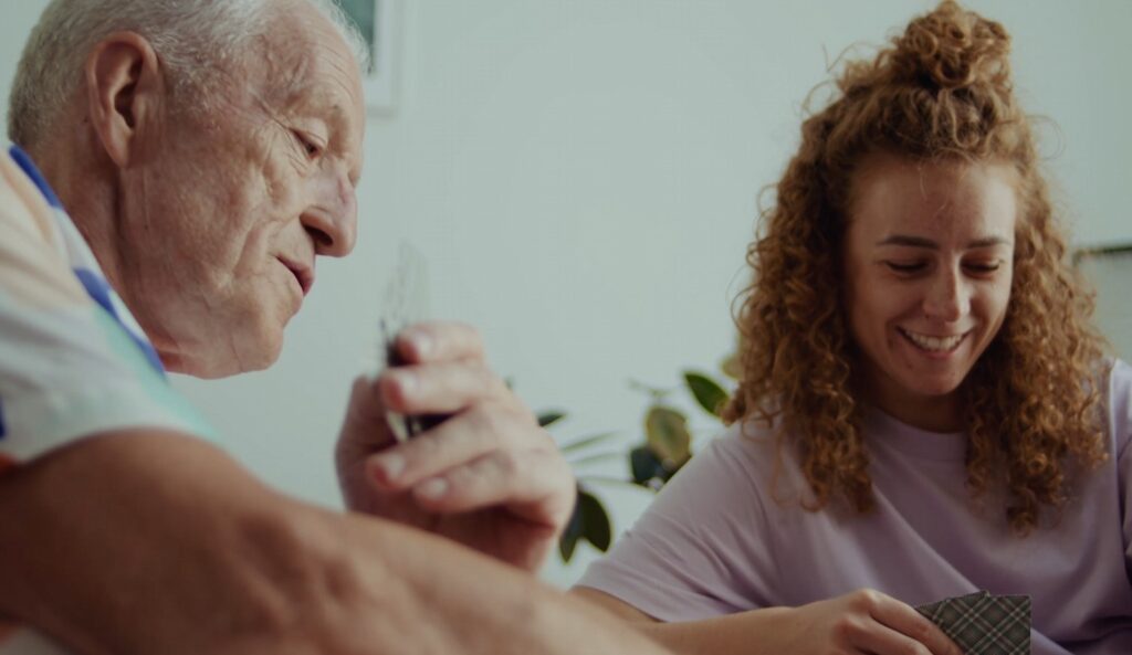 father and daughter playing cards