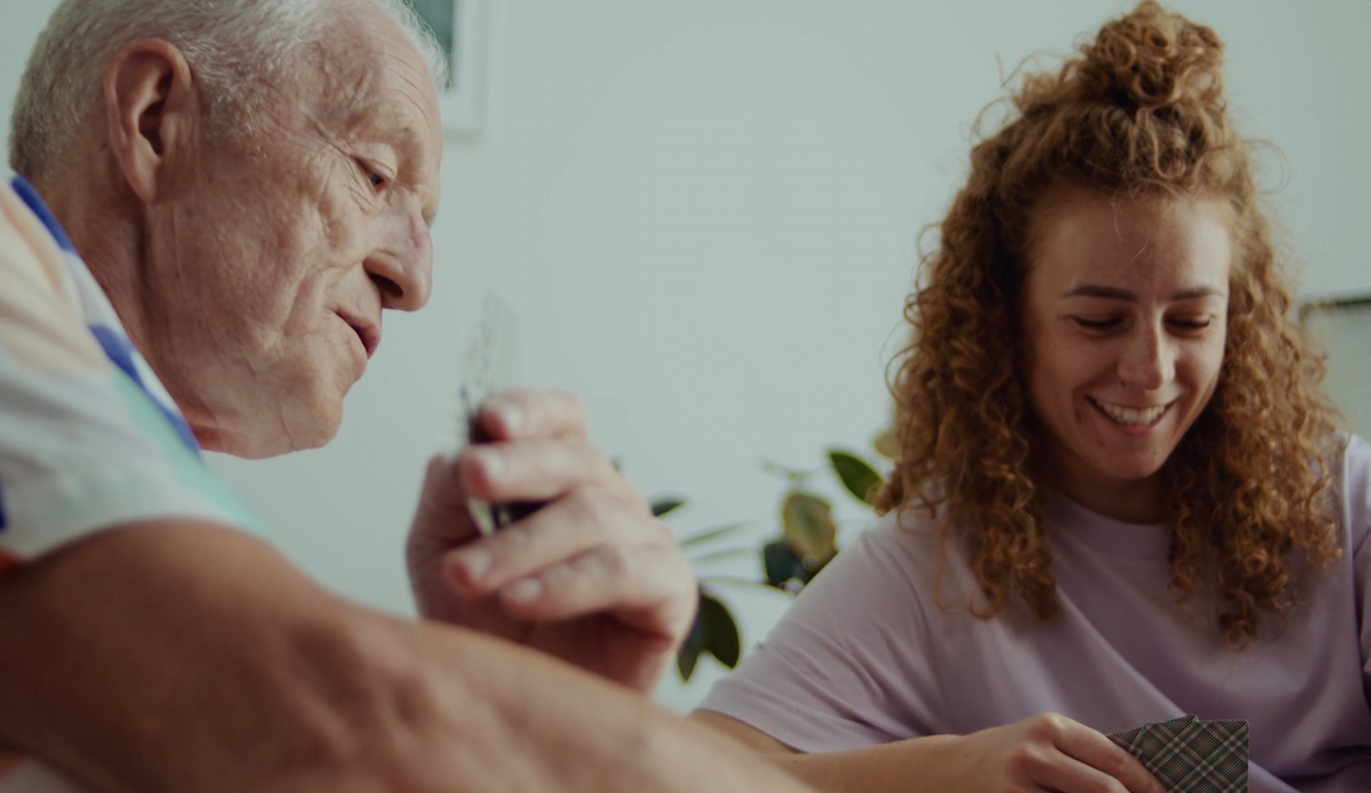 father and daughter playing cards