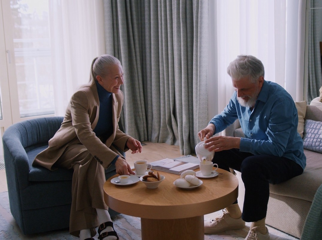 Senior couple talking over tea
