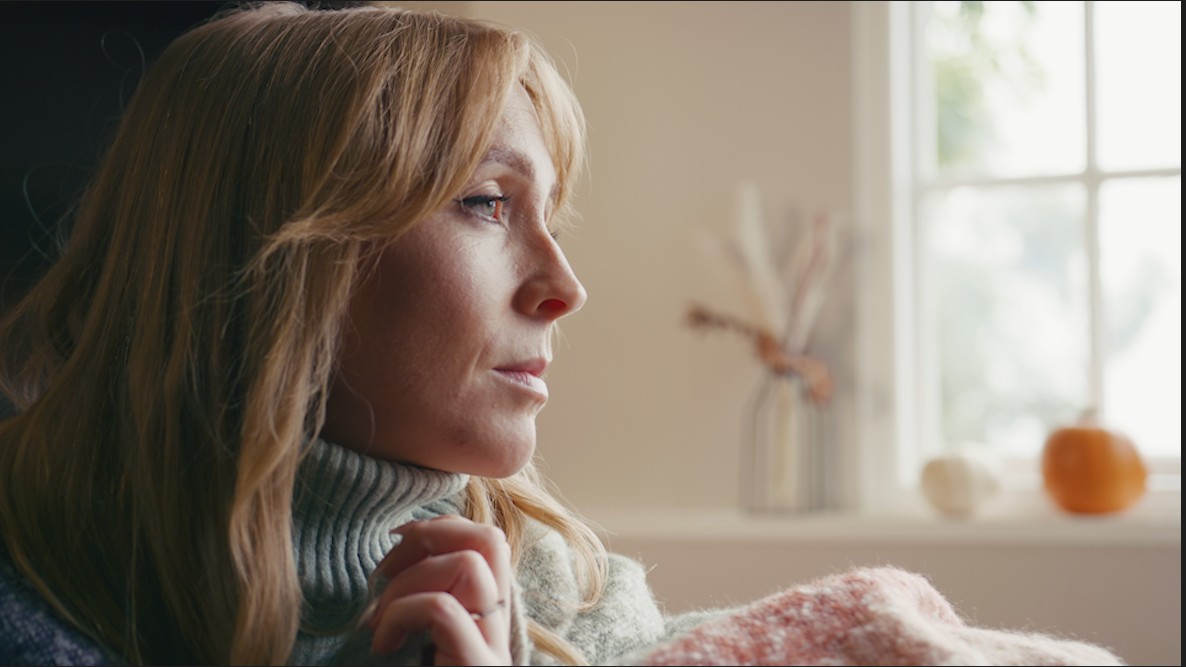 Sad woman looking out the window